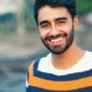 Portrait of a beautifull smiling man indian ethnicity looking at the camera.